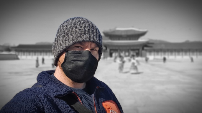 Standing in front of Gyeonbuk Palace in Seoul, South Korea